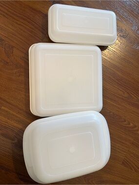 Set of three Tupperware Ovenware containers.